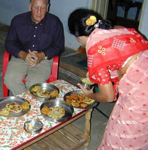 Chapatis with tomato and potato chutneys and savoury ’wadai’.