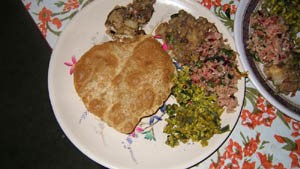 Deep fried ‘puri’ with a selection of vegetable chutneys and savoury rice.
