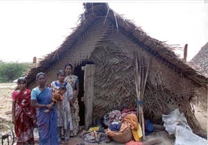 Simple home, made of thatch with a mud floor.