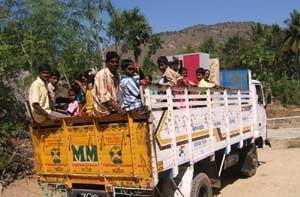 Lorry transporting people.
