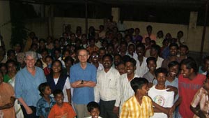 Most of the village turned out for the distribution of the first cheques.