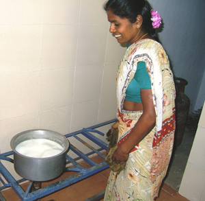 Saradha makes snacks for the elderly and the playcentre children.