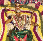 The Goddess Kali Amman surrounded by fresh flowers.