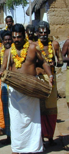 A V-shaped symbol - a stylized representation of Vishnu's footprints - is applied in sandalwood paste to the forehead of followers of Lord Vishnu.