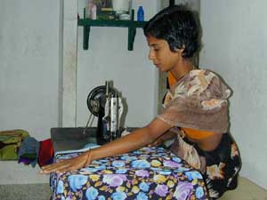 Amudha charges 12 to 15 rupees to make a sari blouse.