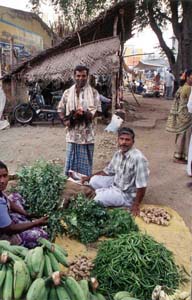 Many traders spread their wares out on the road side on market day.