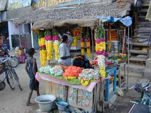 The flower seller is always busy at festival times.
