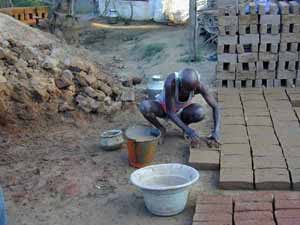 Brick making is done by hand.